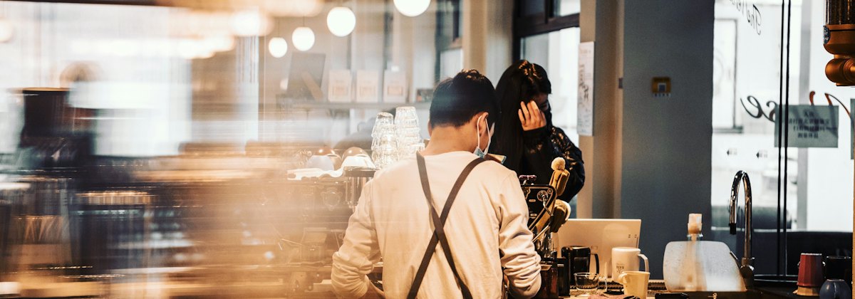 Busy café counter with staff at work