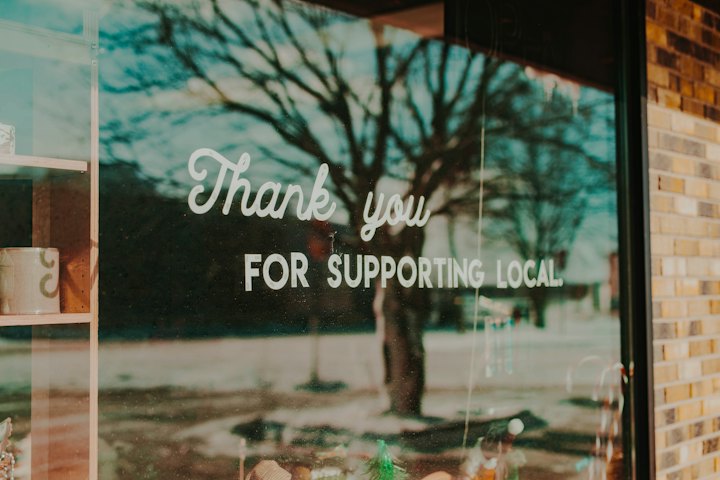 Shop window reading Thank you for supporting local