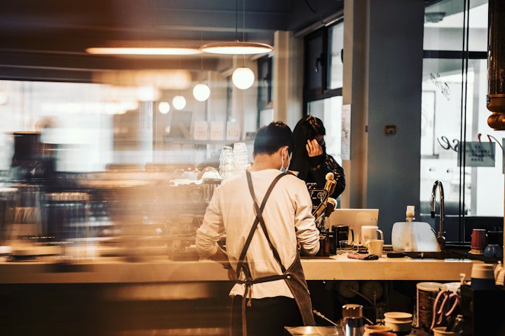 Busy café counter with staff at work